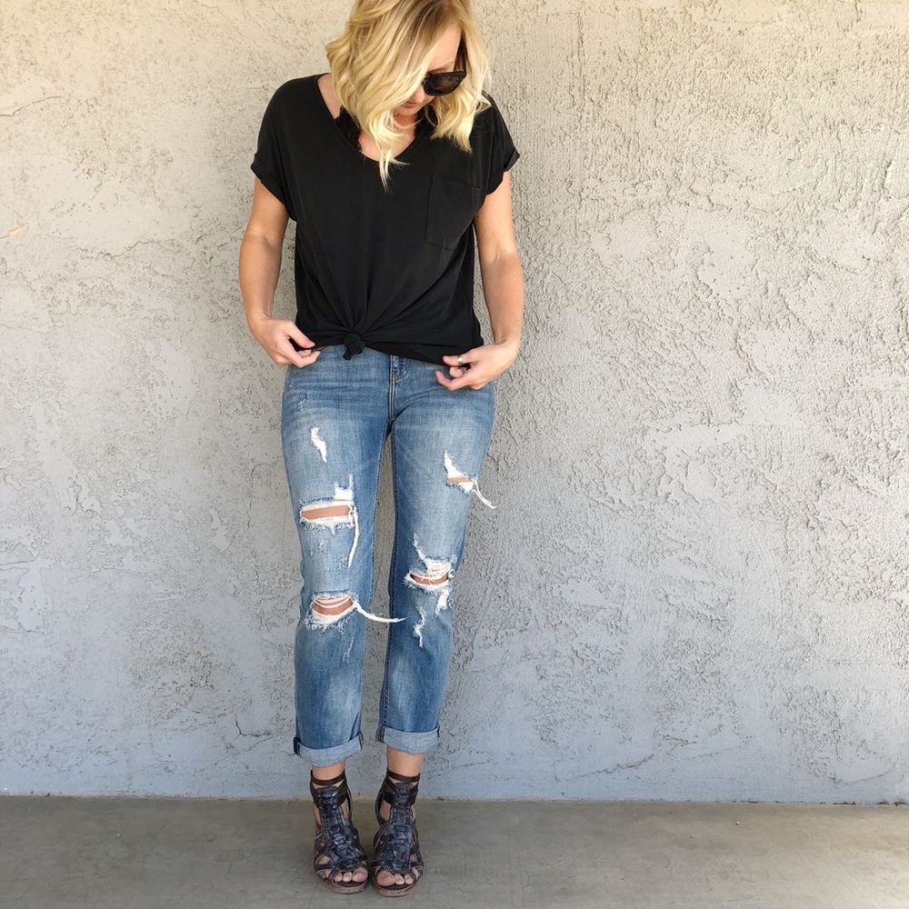 Distressed boyfriend fit jeans.  Frankie